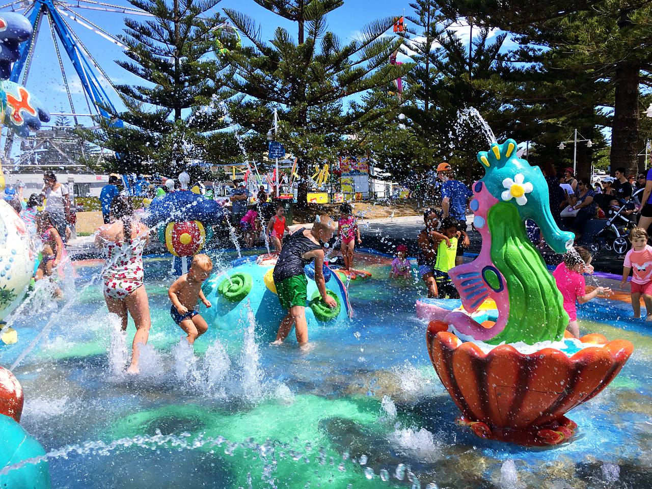 A sculptural sea horse sprays water at children at a Vera's Water Garden.