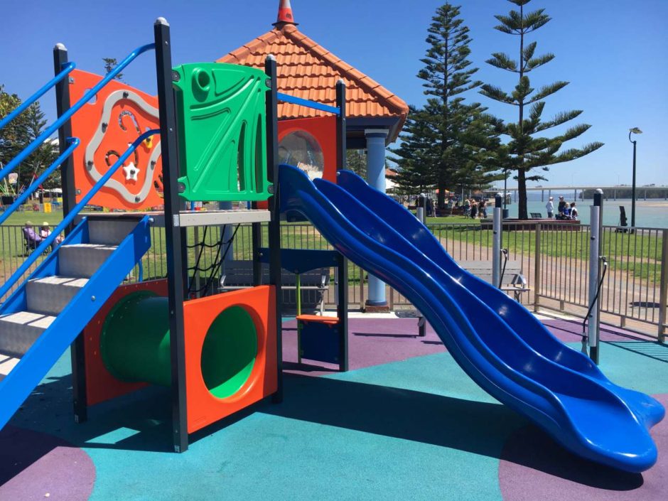 fenced-toddler-park-at-the-entrance-playing-in-puddles